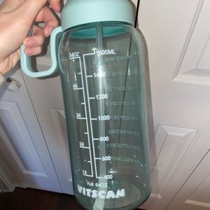 Blue 64oz water bottle with straw